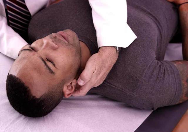 A patient of Dr. Jeremy L. Coleman receiving an adjustment on his neck.